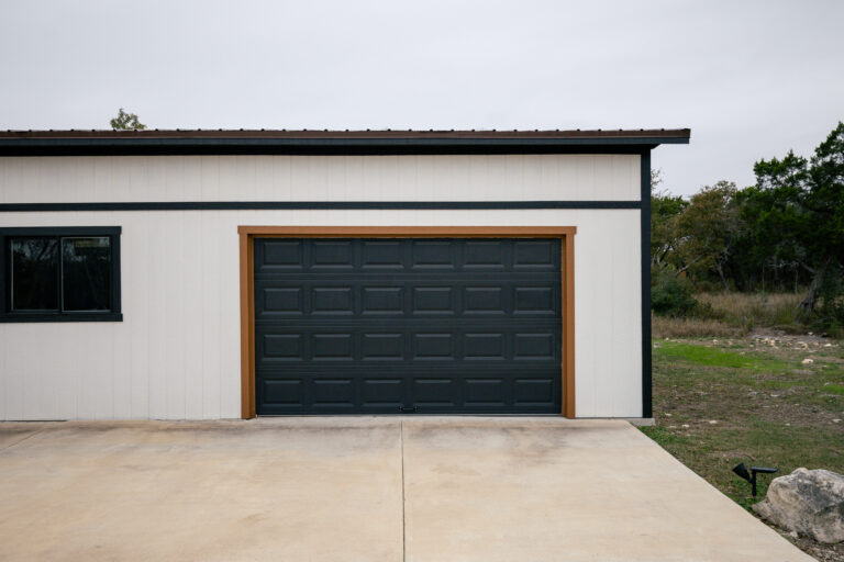 black garage door with wood trim