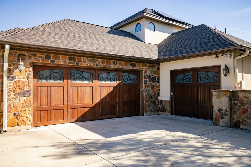 garage door tune up wooden garage door big house blue sky sunny day