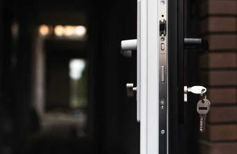 New plastic door in a private house made of dark brick