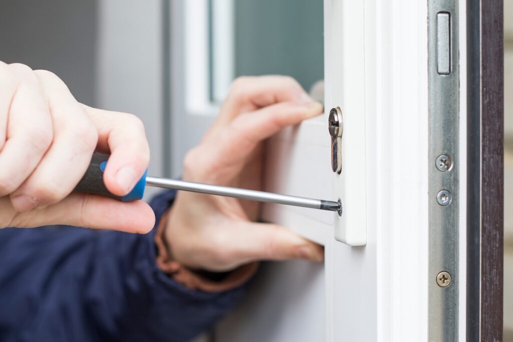 Worker fixing entry door frame